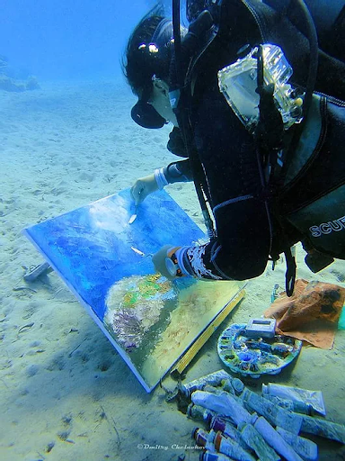 Olga Nikitina painting underwater.  Via olganikitinart.com.